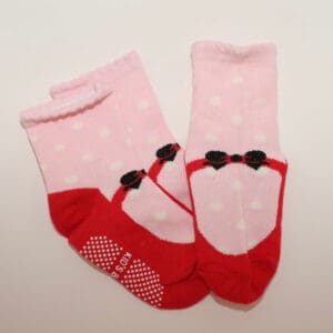 Pink polka-dot baby socks with red toes