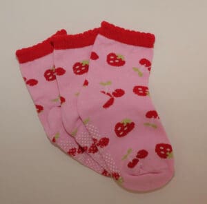 Three pink ankle socks with strawberry pattern