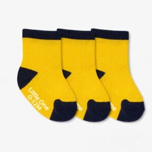 Three yellow and navy baby socks